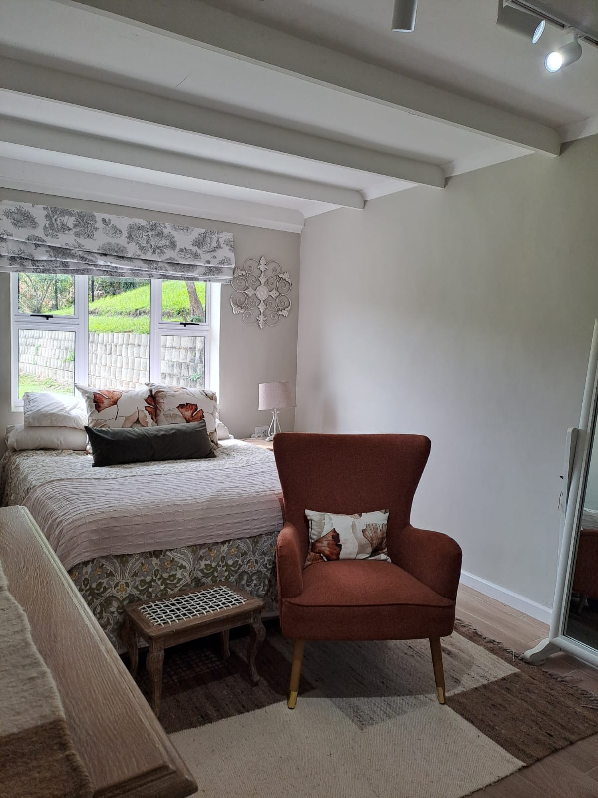 Bedroom with reading chair and garden outlook